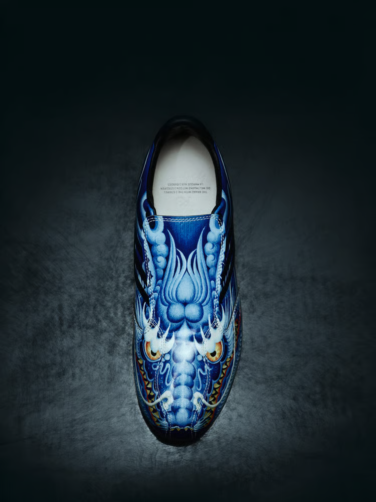 The Y-3 F50 Tunit football boot with a dragon design - Y-3 